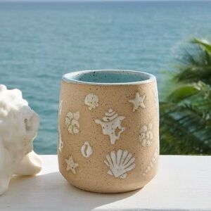 Handmade ceramic sea shell cup and spoon